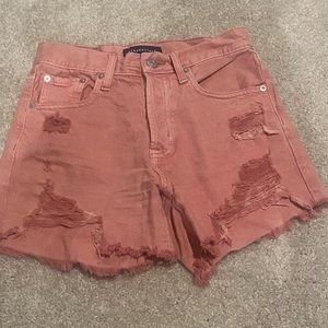 Aeropastel 90s high rise cut off coral colored distressed jean shorts